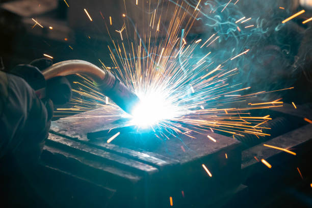 Welding of steel, sparking, not wearing gloves, light colored like fireworks Welding of steel, sparking, not wearing gloves, light colored like fireworks. safety first at work stock pictures, royalty-free photos & images