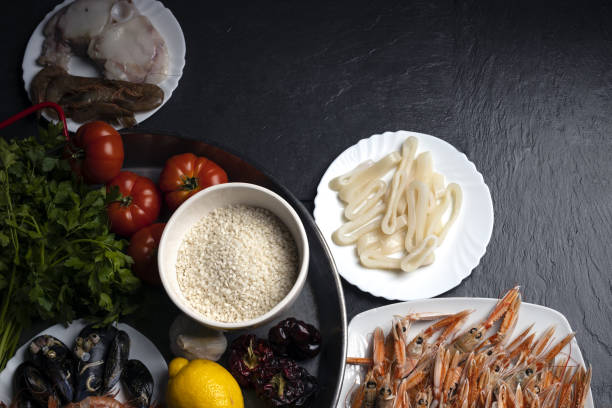 Spanish food paella materials on the table.