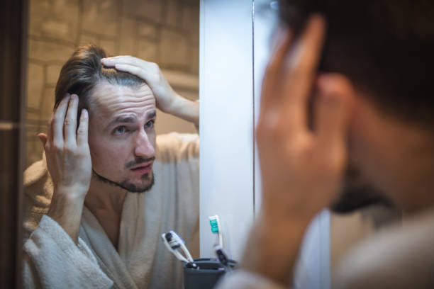 istock Middle aged man in the bathroom 1394278112