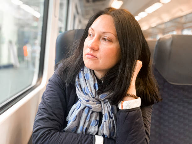 istock Young woman is traveling in a train. 1394278116