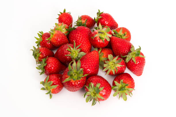istock Heap of strawberries on white 1394279401
