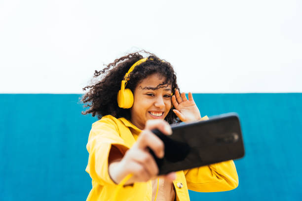 istock Young happy woman dancing and having fun outdoor 1394281119