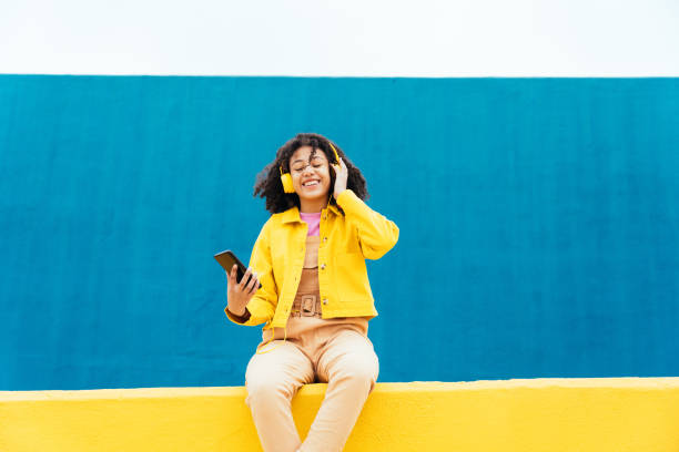 istock Young happy woman dancing and having fun outdoor 1394281151