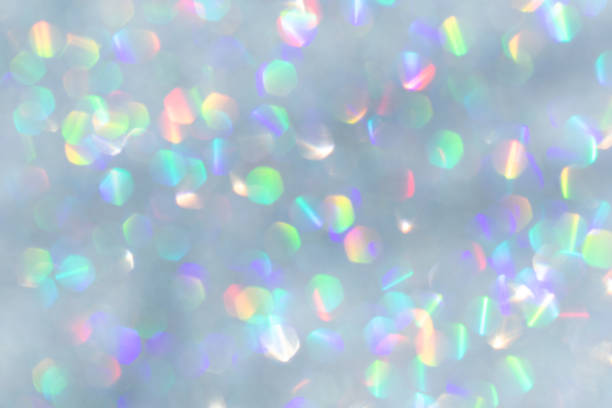 Abstract defocused silver background with shining glitter.Good as overlay layer.