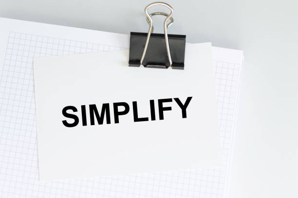 istock Text simplify on a card clip to a notepad on the table 1394282136