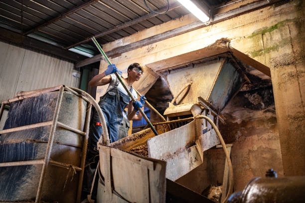 istock Blue-collar woman working in the Quartz ore Processing plant 1394283171