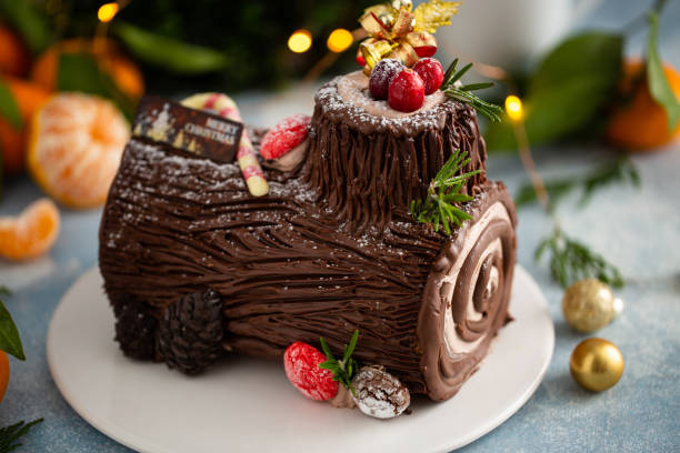 istock Yule log chocolate cake with frosting for Christmas 1394283277