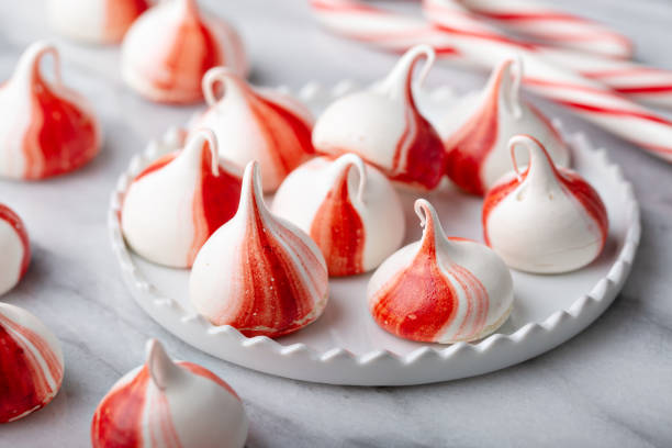 istock Peppermint meringues on a marble table, Christmas treat 1394283302