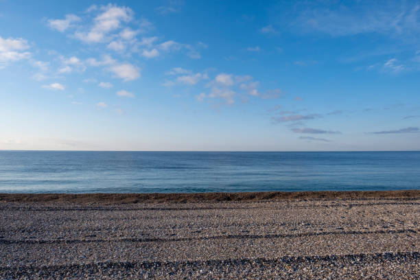 a sea coast with blue sky stock photo