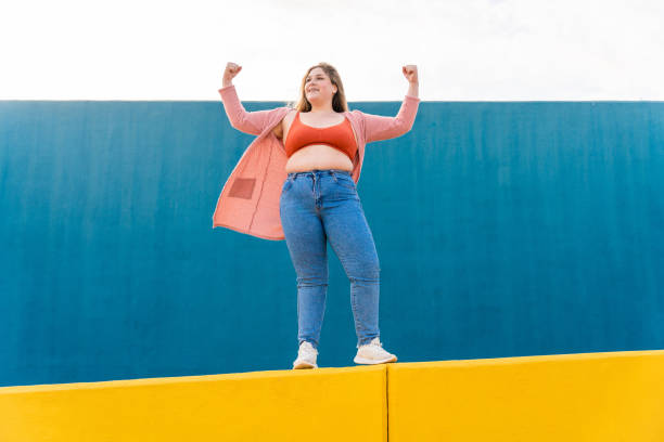 istock Beautiful plus size young woman outdoors 1394285596