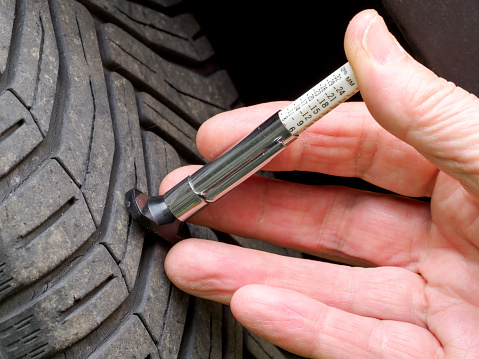 Measuring depth of tire tread