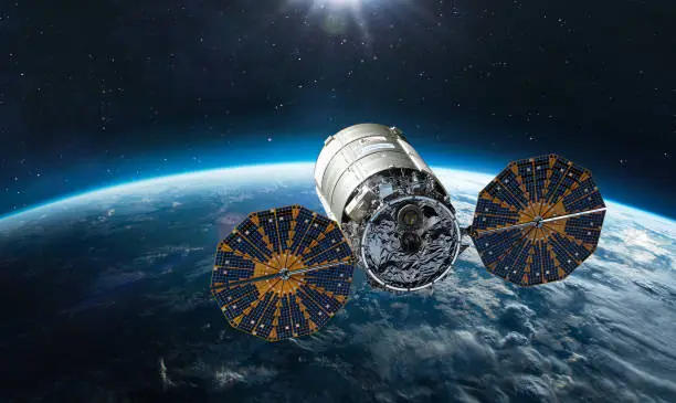 Photo of Cygnus spacecraft flight in space. Cygnus on orbit of Earth. Sci-fi wallpaper. Cargo expedition of Antares to ISS space station. Spaceship with astronauts. Elements of this image furnished by NASA