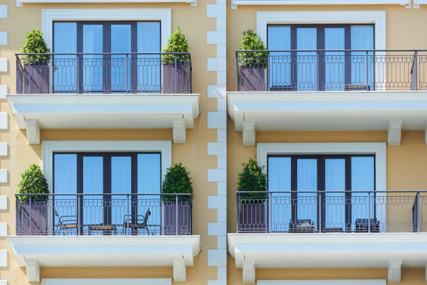 istock Facade of a building with balconies and plants 1394289007