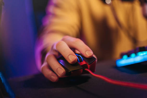 Close up of gamer's hand on professional computer mouse