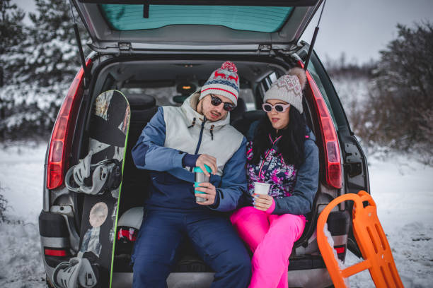 istock Couple drinking hot drink in nature in winter 1394290824