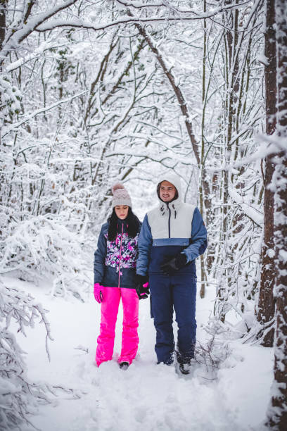 istock Couple walking hugged and enjoying the snow 1394290841