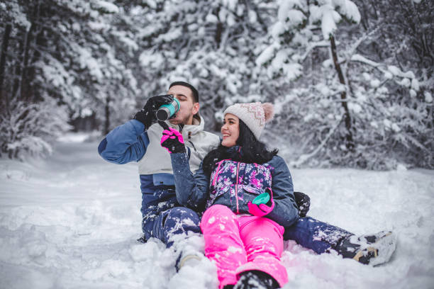 istock Couple walking hugged and enjoying the snow 1394290861