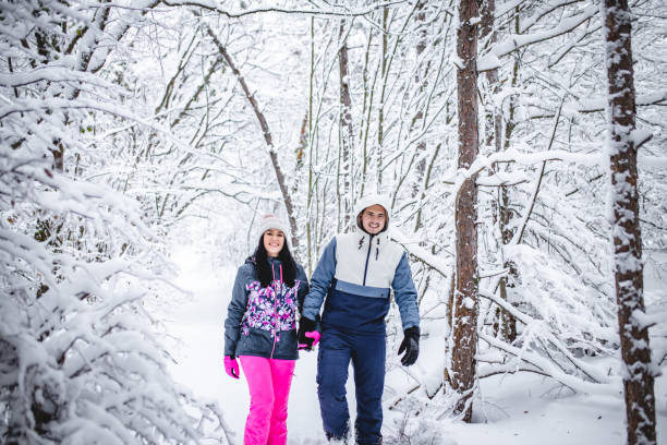 istock Couple walking hugged and enjoying the snow 1394291021
