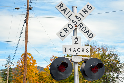 Close up of a railroad crossing sign with lights
