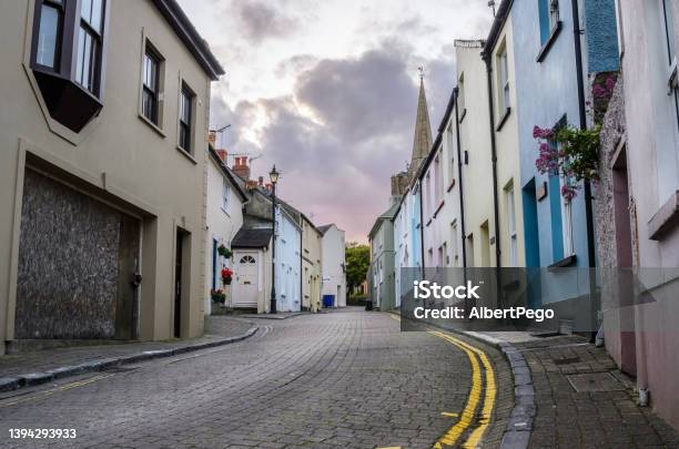 Old Pastel Houses Along A Cobblestone Street In A Town Centre At Dusk Stock Photo - Download Image Now