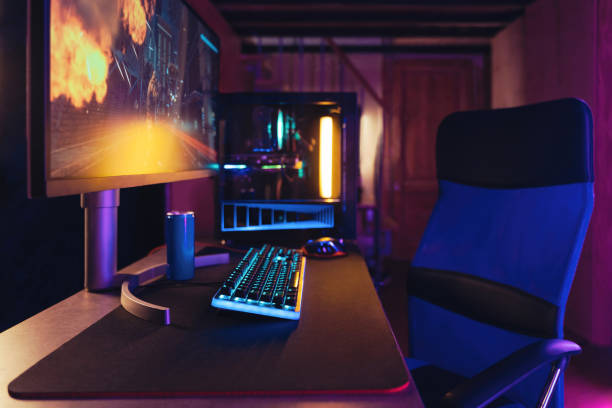 istock Professional gaming PC setup in neon room 1394294793