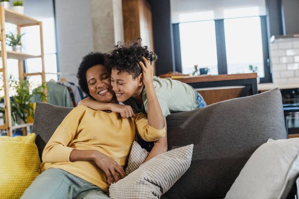 African-American mother and her son at home stock photo