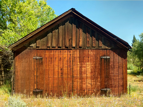a rural farm prairie ranch barn natural wood shed backyard garage storage building
