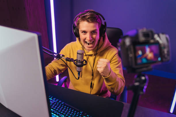 istock Happy pro gamer influencer shooting video on camera 1394303477
