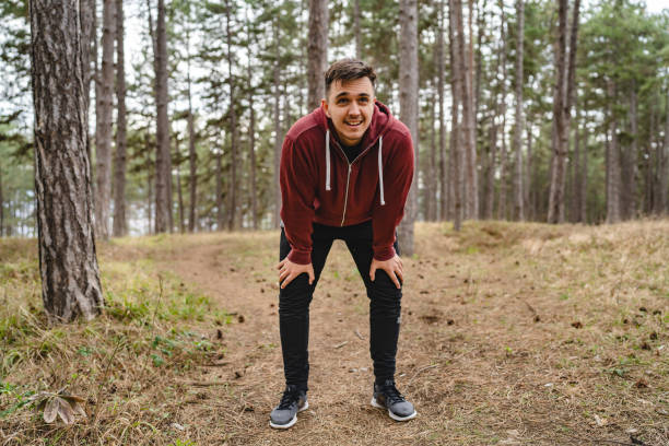 istock One man taking a brake during training in nature tired caucasian male taking breath while making a pause while train in forest or public park alone real people copy space 1394304291
