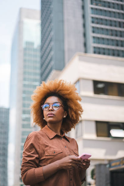 istock Businesswoman sending message by smartphone 1394305767