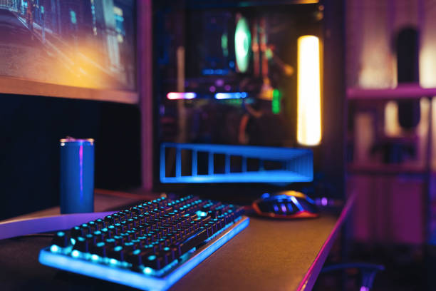 empty gaming studio with professional setup in neon light - computer keyboard audio imagens e fotografias de stock