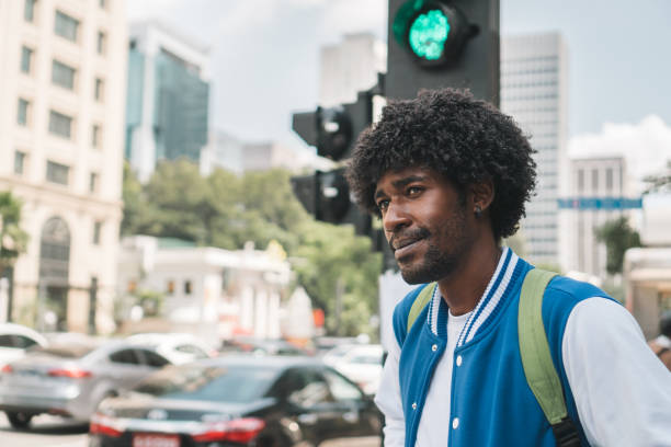 istock Pedestrian waiting for the green traffic light 1394306017