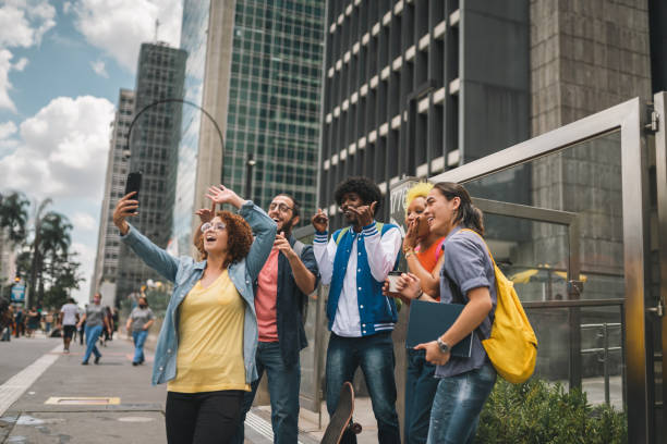 istock Multi-ethnic group of teenagers outdoors vlogging 1394307447