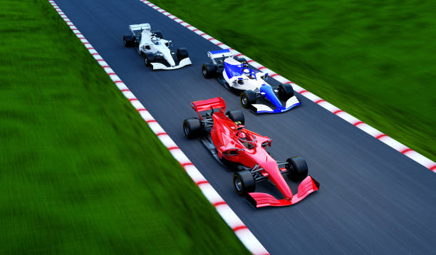 istock red race car leading on a race track 1394308841