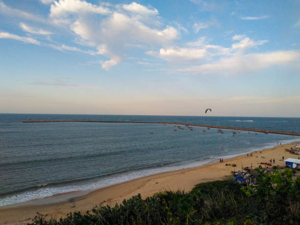 Vila do Mar. Urban coastal region of the city of Fortaleza. Place with great historical value for the city of Fortaleza. Region with a beautiful coastline, but little valued due to the fact that the location is in peripheral neighborhoods with socioeconomic problems. Close to the city's ground zero, the region of Barra do Ceará. Place used by the population as a source of leisure and for sea sports activities such as surfing and kitesufing. kiteboarding stock pictures, royalty-free photos & images