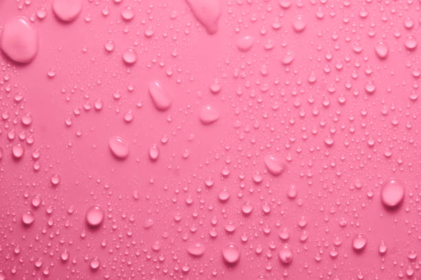 istock Violet pastel water drops on light shiny surface 1394316678