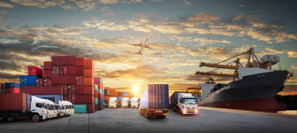 istock Logistics and transportation of Container Cargo ship and Cargo plane with working crane bridge in shipyard at sunrise, logistic import export and transport industry background 1394317234