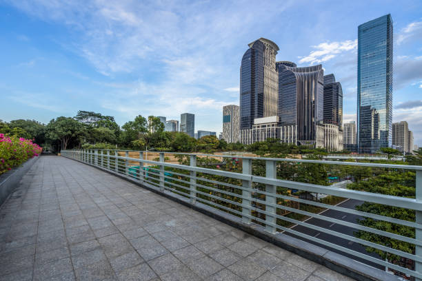 istock empty pavement and modern buildings in city 1394319640