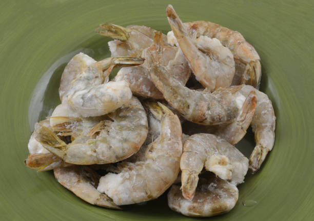 istock Freezer burned shrimp in the shell coated with ice crystals 1394319726