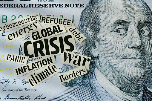 Benjamin Franklin looking Global Crisis newspaper headlines on One Hundred Dollar Bill