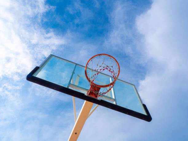 istock basketball hoop and blue sky. 1394325850