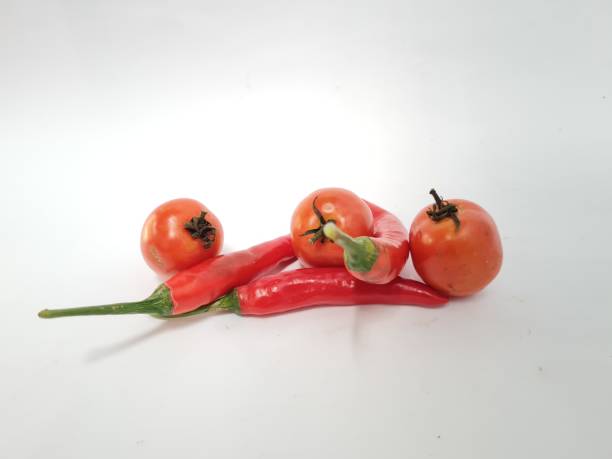 istock Big red chili and red tomatoes 1394326555