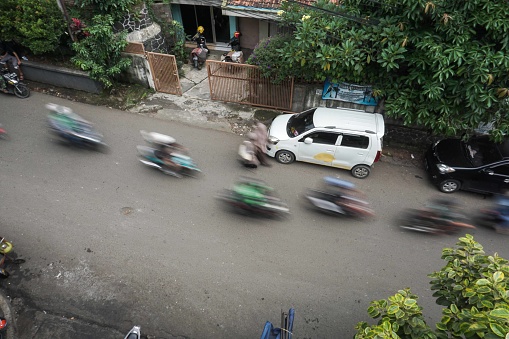 Bandung, Indonesian - April 20, 2022 : Activities of people on the street