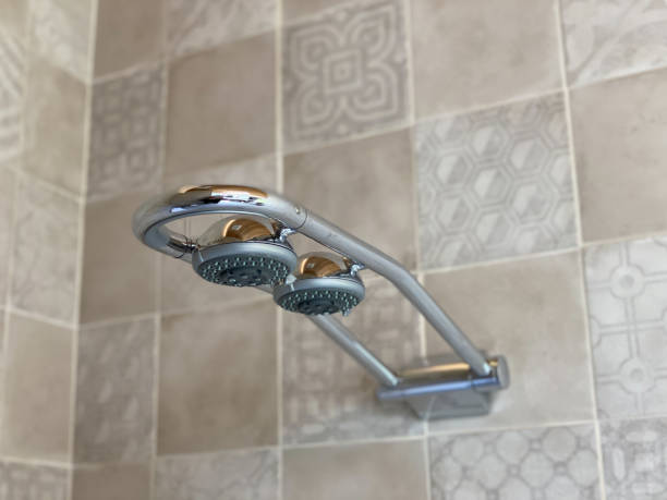 istock Dual shower head in modern shower with tile 1394328993