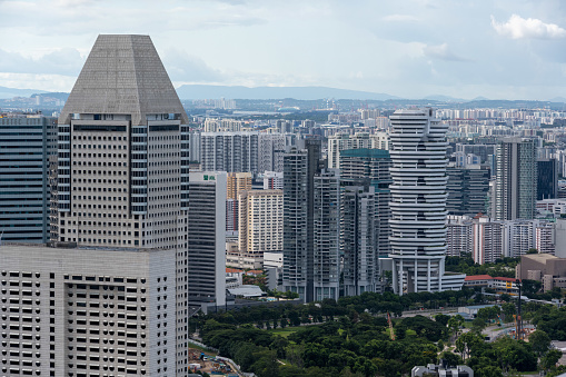 Aerial view of high rise residental buildings in Singapore, seen a cloudy afternoon in the summer in southeast Asia.