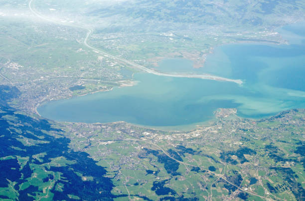 Aerial view of the eastern end of Lake Constance View from the air of the Eastern end of Lake Constance with the mouth of the River Rhine flowing in from the top of the image.  Around the shore are the towns of Lindau, Lochau and Bregenz with the River Rhine flowing into the lake from the top of the image.  Sunny spring morning. bregenz stock pictures, royalty-free photos & images