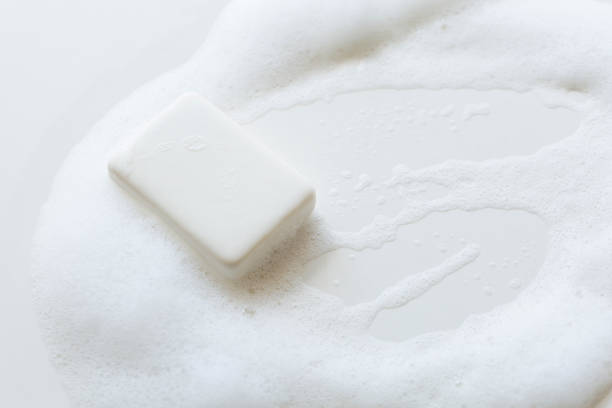A bar of white soap in a rich lather. Still Life.