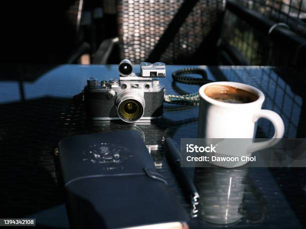 A Customized Classic Film Camera With A Cup Of Coffee Stock Photo - Download Image Now