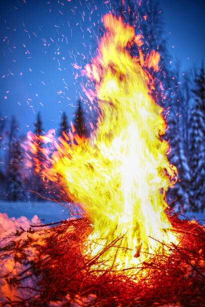 istock Big fire in winter landscape with flying sparks 1394345842