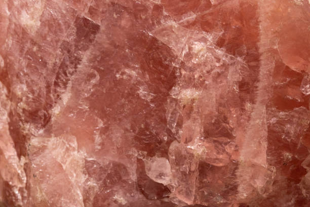 istock Rose quartz close up. Quartz texture, paleontological background and its structure 1394346519